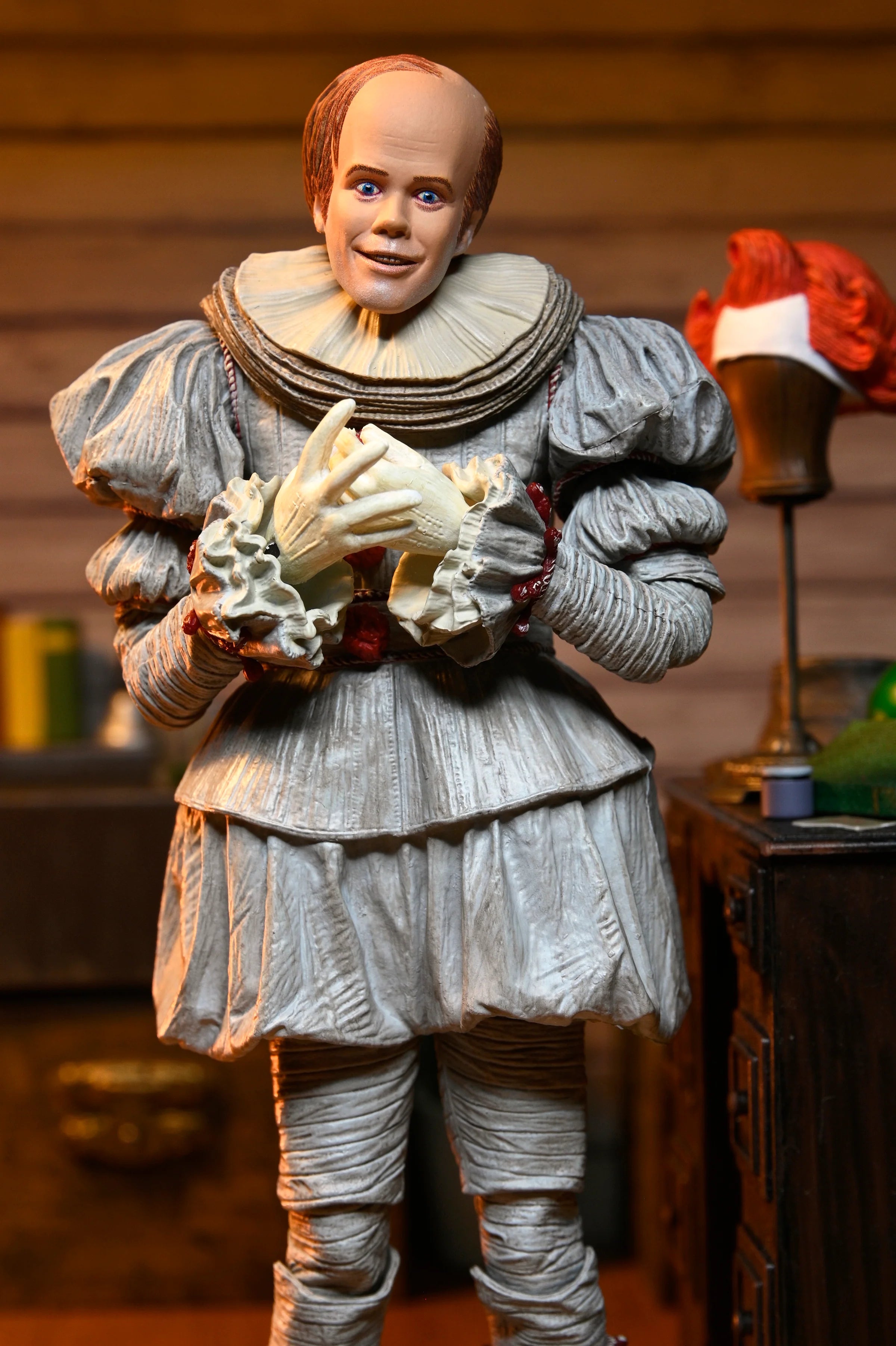 NECA - IT: Welcome to Derry - Ultimate Bob Gray as Pennywise 7" Scale Action Figure (Pre-Order Ships April 2026)