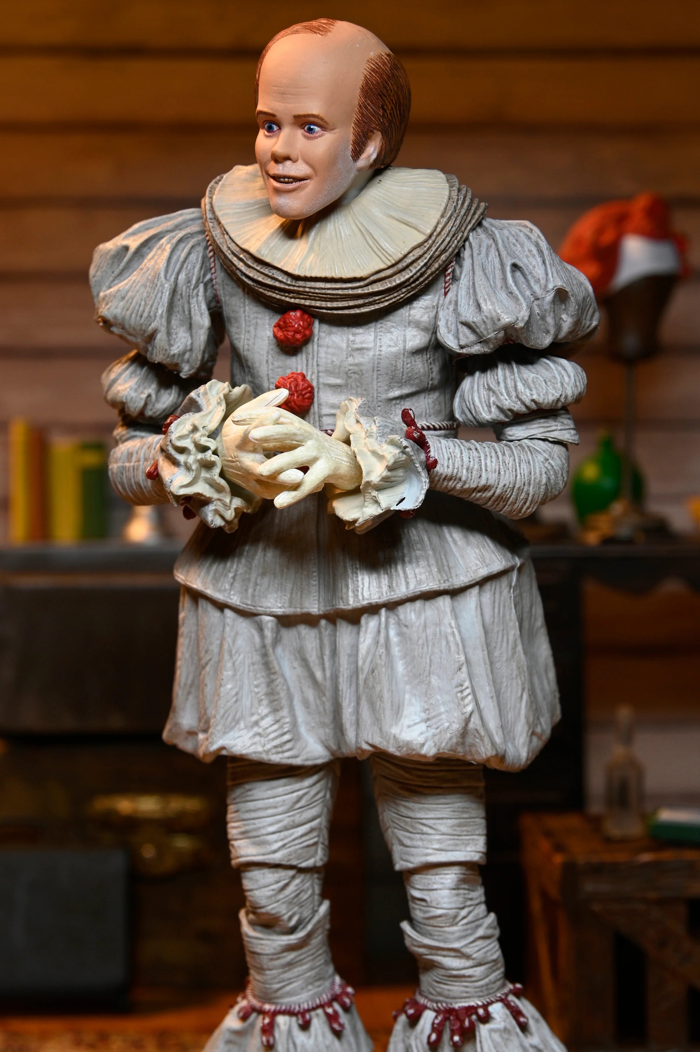 NECA - IT: Welcome to Derry - Ultimate Bob Gray as Pennywise 7" Scale Action Figure (Pre-Order Ships April 2026)